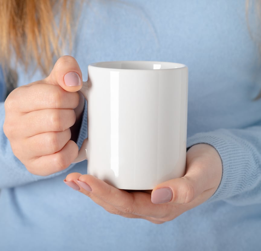 Person Holding a Mug